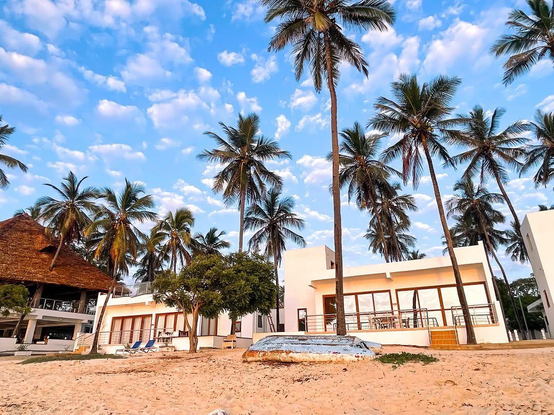 Palm trees and beachfront buildings at Kilifi Pearl Beach Resort